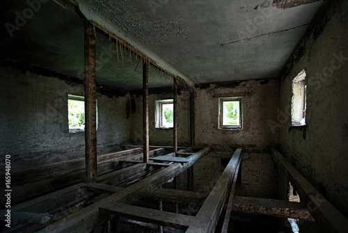 Old destroyed house with beams © savelov