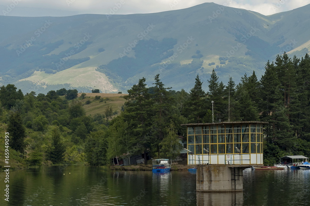 Environment of the dam, reservoir or barrage  Dushantsi at river Topolnitsa with passenger-ship, Central Balkan mountain, Stara Planina, Bulgaria