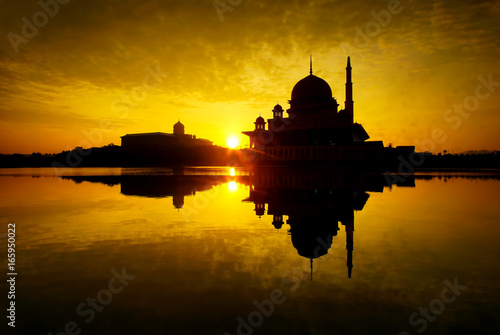 Breathtaking sunrise views with Putra Mosque, Putrajaya,  Malaysia. Charming Islamic architecture.