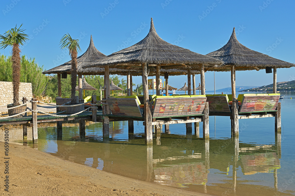 Beach bar with straw roofs