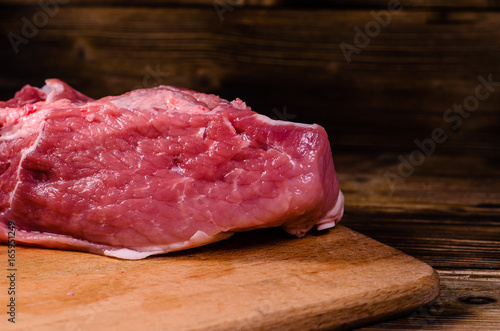 Raw pork meat on cutting board