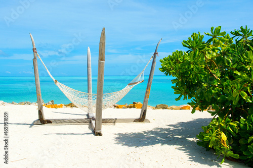 Fototapeta Naklejka Na Ścianę i Meble -  Beautiful landscape with hammock on the sandy beach, Maldives island