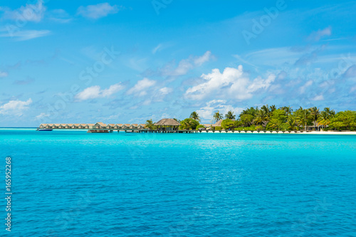 Over water wooden pier for boats and seaplanes, Maldives island