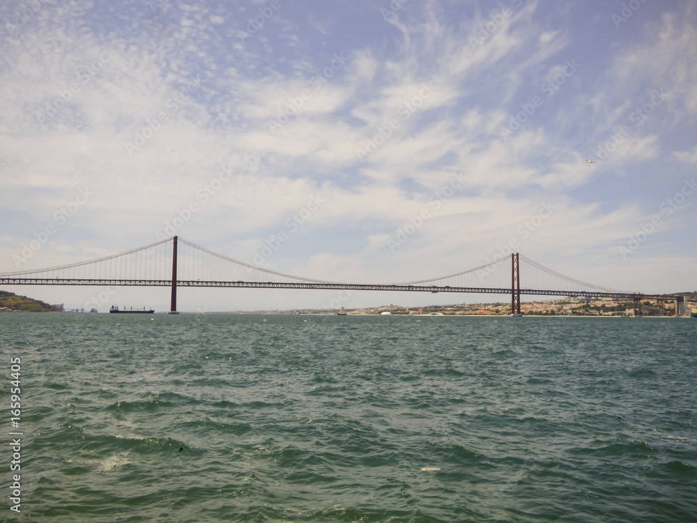 The bridge 25th of April viewed from the other side of river Tagus - Cacilhas, Almada