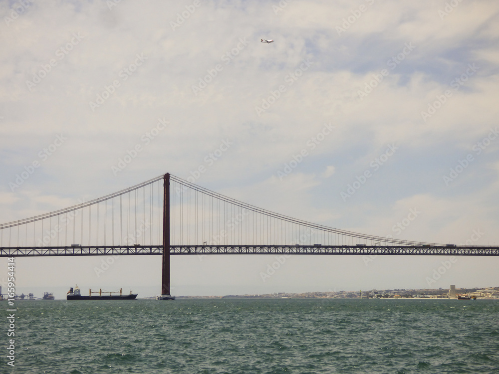 The bridge 25th of April viewed from the other side of river Tagus - Cacilhas, Almada