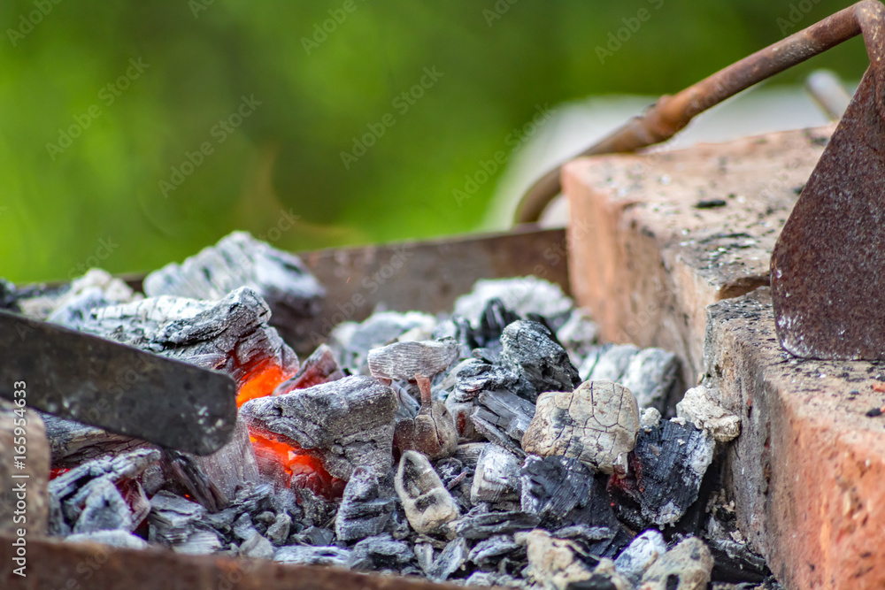Coals in the smithy in the open air
Coals in the smithy in the open air