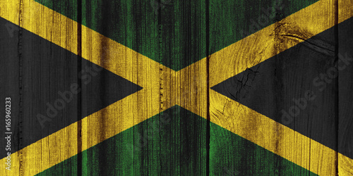 Jamaica flag painted on wooden wall for background