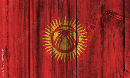 Kyrgyzstan flag painted on wooden wall for background