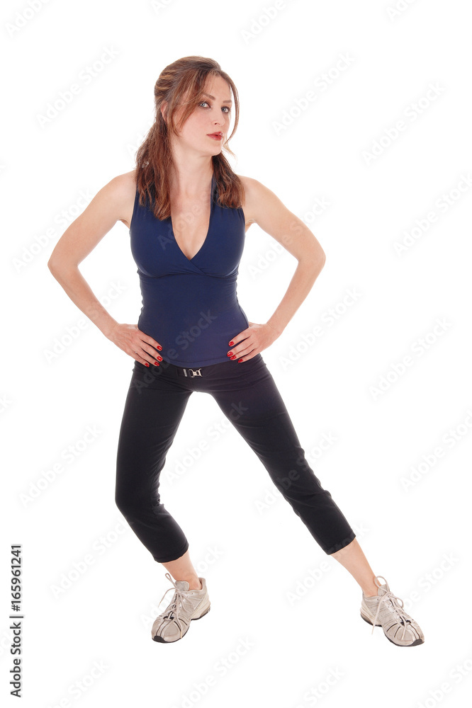 Exercising woman with her hands on hip Exercising woman with her hands on hip