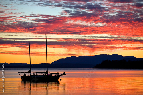 Sailboat at sunset on the west coast of British Columbia 