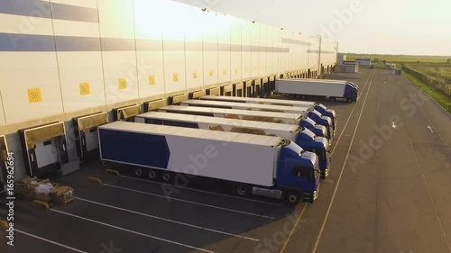 distribution warehouse with trucks awaiting loading