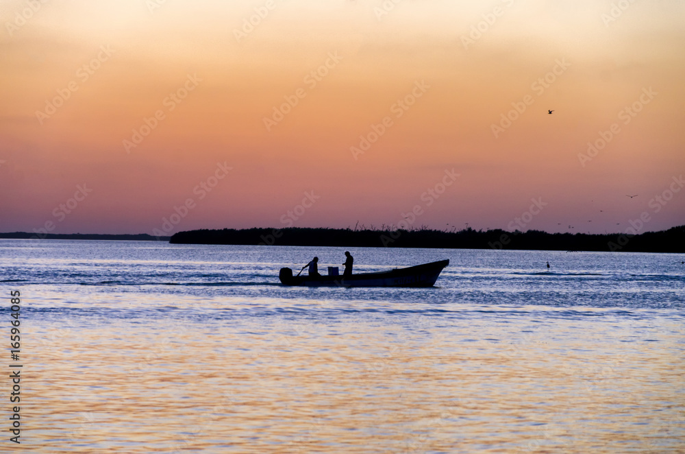 Men fishing at Sunset in Rio Lagartos