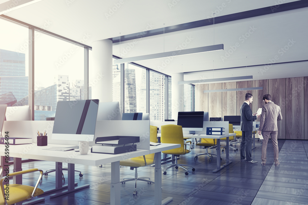Loft open office with a wooden wall, men Loft open office with a wooden wall, men