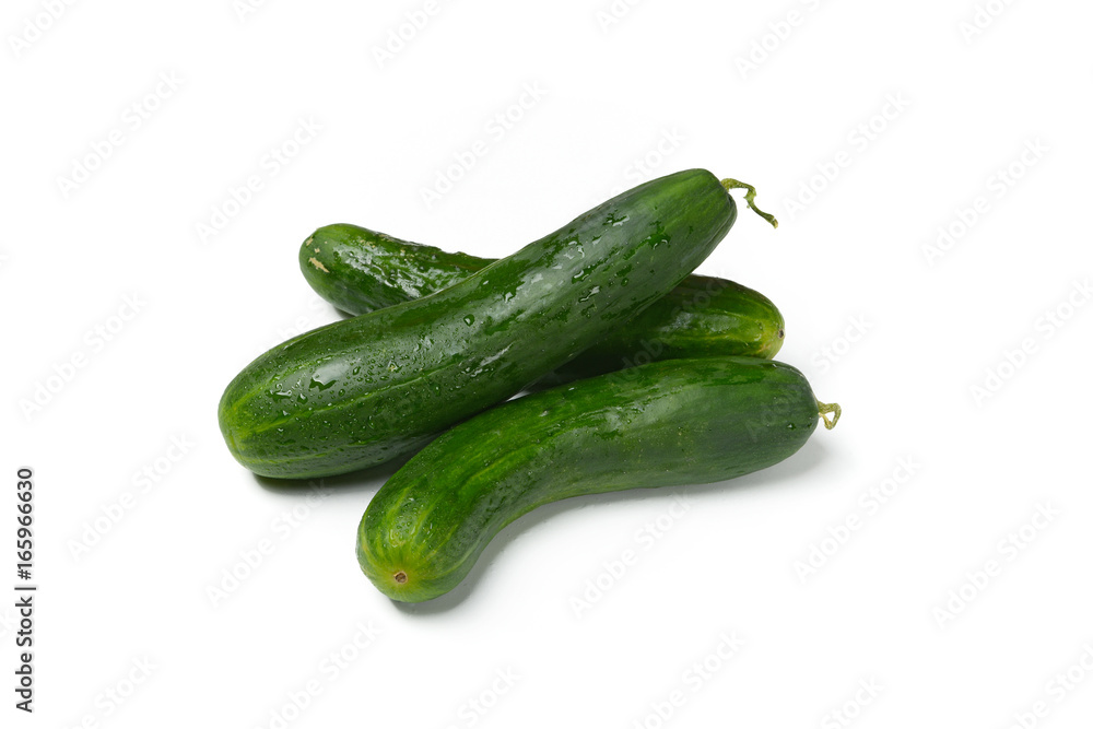 Heap of green cucumbers on white background Heap of green cucumbers on white background