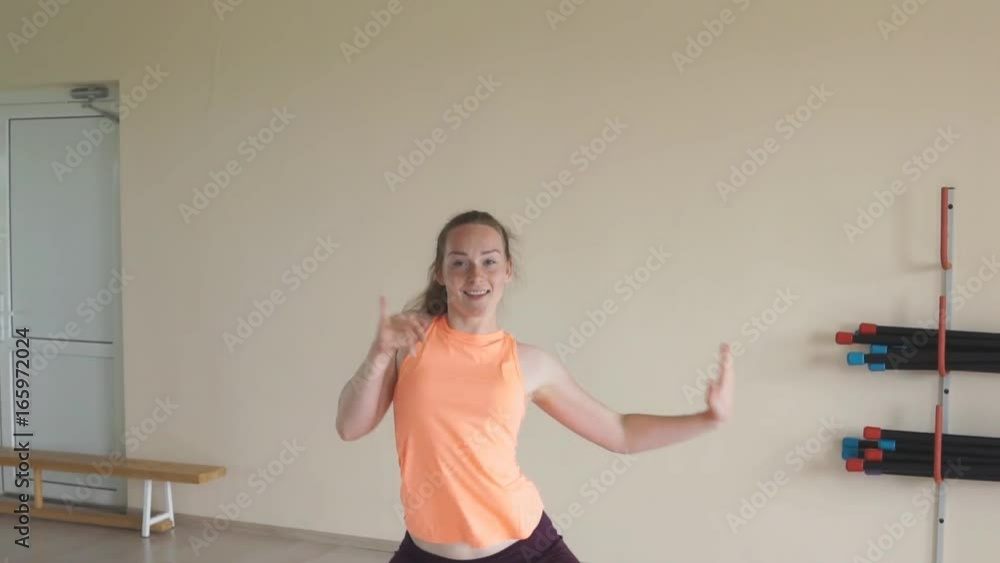 fitness girl doing mixed dance exercises in gym or studio. slow motion. fitness girl doing mixed dance exercises in gym or studio. slow motion.