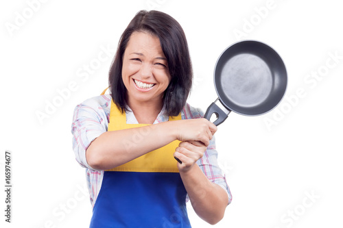 Anger, Fury and Rage Young Woman with Frying Pan