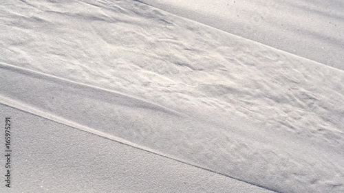 Water trickles down smooth white sand, Dubai