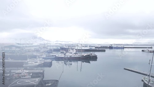 Fog rolls over shipyard, aerial