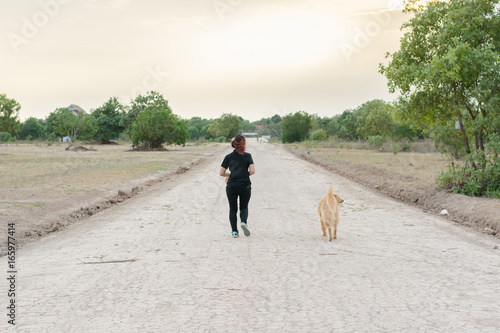 woman and golden dog on riverside © Achira22