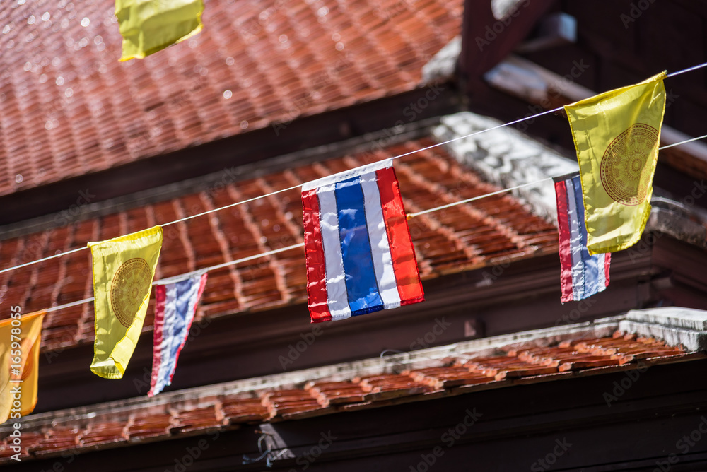 Thai flags and buddhism yellow flags in the temple.