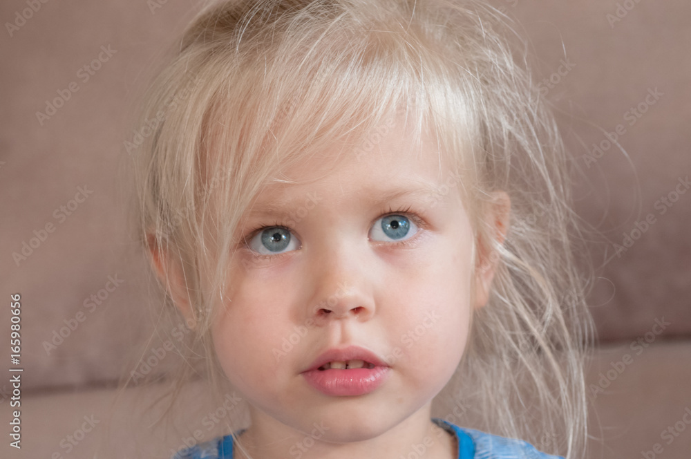 Portrait of a little girl with blue eyes and blond hair Portrait of a little girl with blue eyes and blond hair