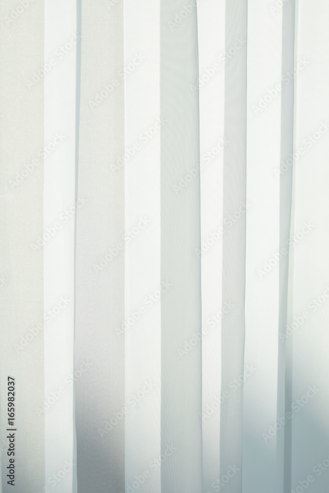 Close up sheer curtain with beautiful sunlight in the morning Close up sheer curtain with beautiful sunlight in the morning