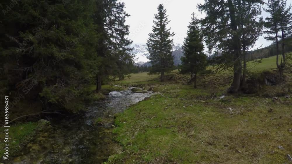 Drone flying over mountain rivulet near Dolomites, amazing landscape, Italy Drone flying over mountain rivulet near Dolomites, amazing landscape, Italy
