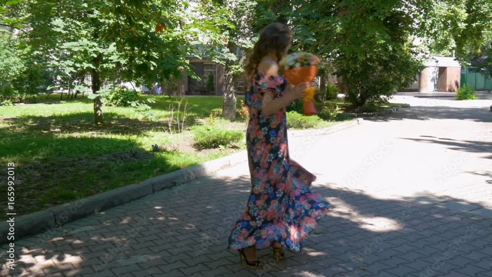 Young beautiful woman whirls in dance, slow motion Young beautiful woman whirls in dance, slow motion