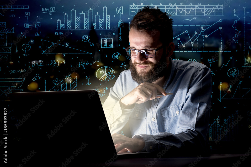 Businessman in the office at night Businessman in the office at night