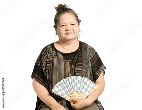 portrait of a mature woman with folding fan. Isolated on white background with clipping path