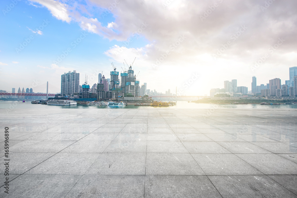 Empty floor with modern skyline and buildings