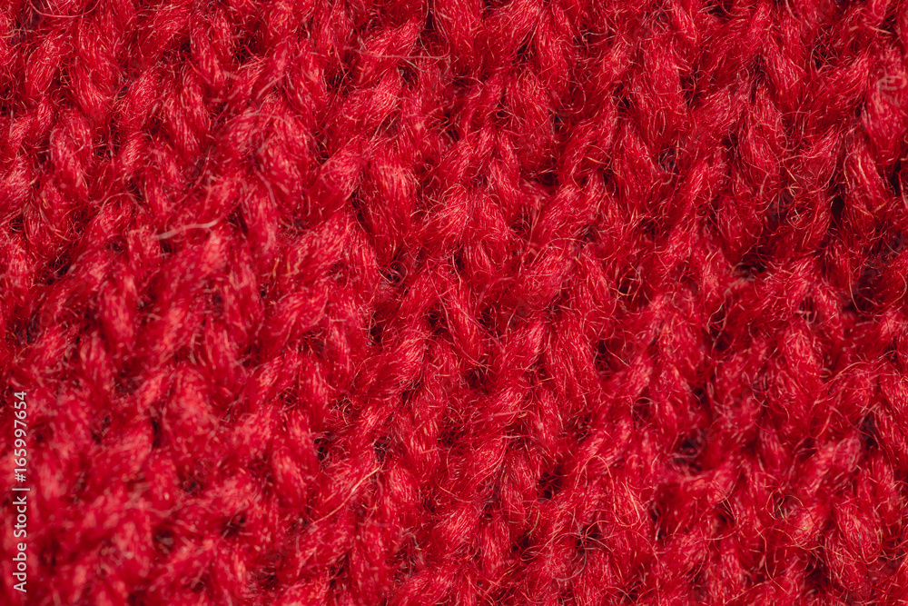 A beautiful closeup of a hand knitted warm and soft wool pattern. Soft socks or scarf of natural wool. Colorful pattern. A beautiful closeup of a hand knitted warm and soft wool pattern. Soft socks or scarf of natural wool. Colorful pattern.