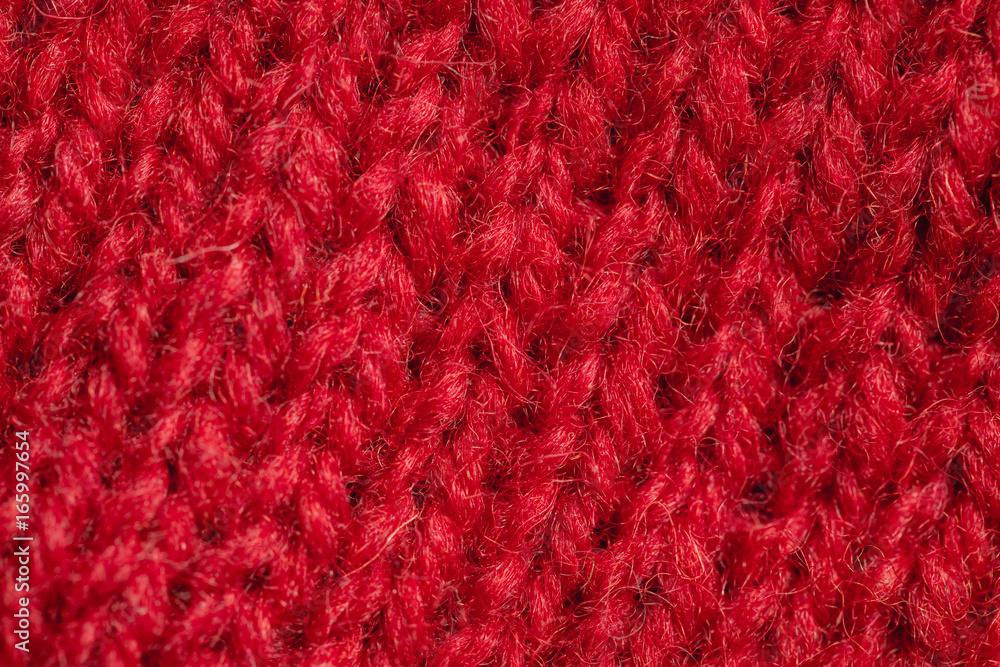 A beautiful closeup of a hand knitted warm and soft wool pattern. Soft socks or scarf of natural wool. Colorful pattern.