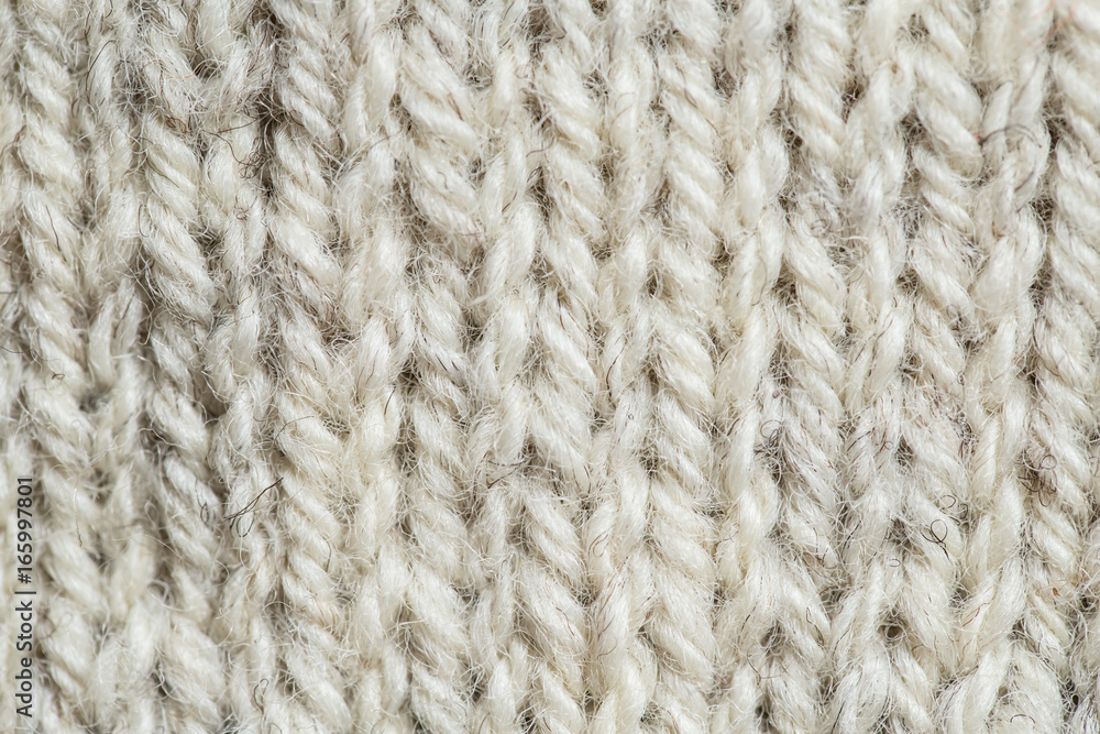 A beautiful closeup of a hand knitted warm and soft wool pattern. Soft socks or scarf of natural wool. Colorful pattern. A beautiful closeup of a hand knitted warm and soft wool pattern. Soft socks or scarf of natural wool. Colorful pattern.