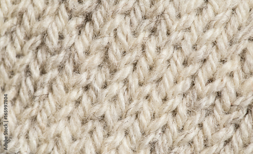 A beautiful closeup of a hand knitted warm and soft wool pattern. Soft socks or scarf of natural wool. Colorful pattern. A beautiful closeup of a hand knitted warm and soft wool pattern. Soft socks or scarf of natural wool. Colorful pattern.