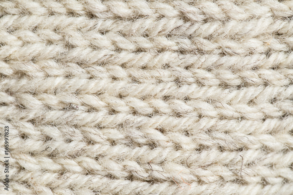 A beautiful closeup of a hand knitted warm and soft wool pattern. Soft socks or scarf of natural wool. Colorful pattern. A beautiful closeup of a hand knitted warm and soft wool pattern. Soft socks or scarf of natural wool. Colorful pattern.