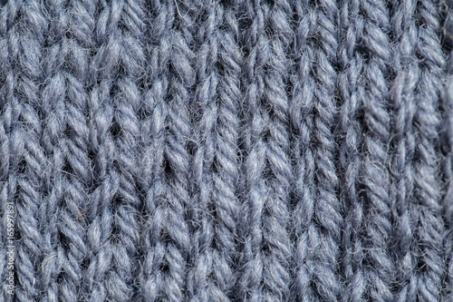 A beautiful closeup of a hand knitted warm and soft wool pattern. Soft socks or scarf of natural wool. Colorful pattern.