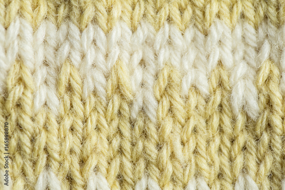A beautiful closeup of a hand knitted warm and soft wool pattern. Soft socks or scarf of natural wool. Colorful pattern. A beautiful closeup of a hand knitted warm and soft wool pattern. Soft socks or scarf of natural wool. Colorful pattern.