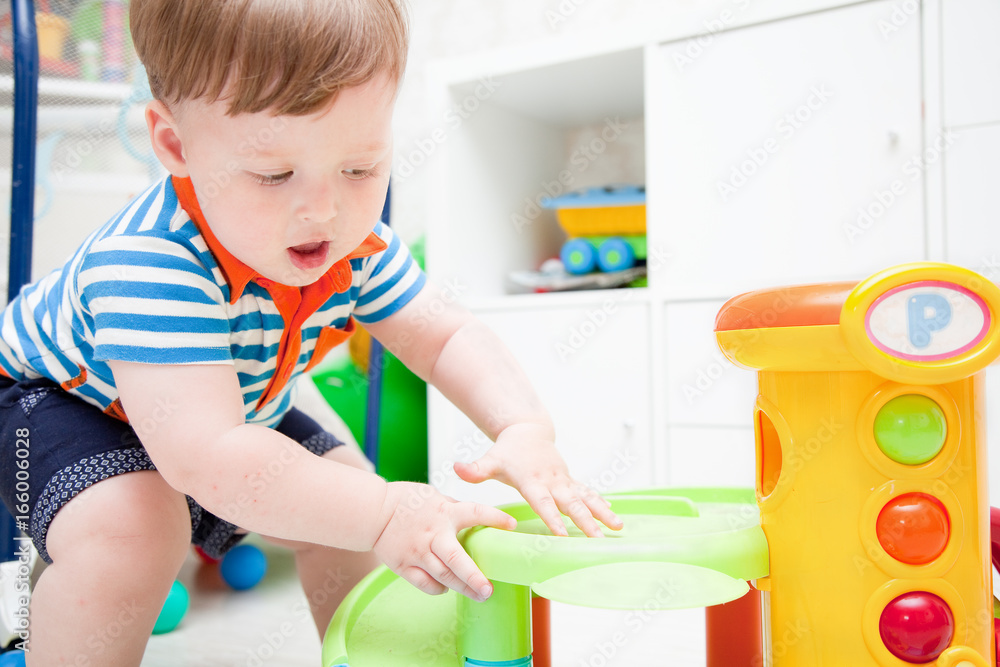 cute little child plays with a machine cute little child plays with a machine