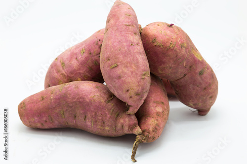 Purple fressh sweet potato on white background photo