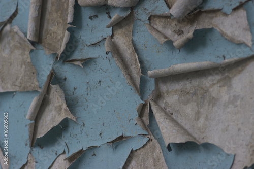 A dilapidated blue paint on the wall