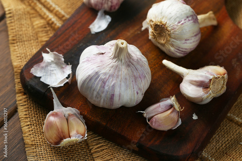 Garlic on vintage wooden board