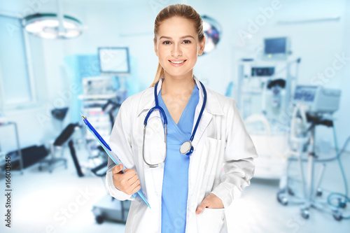 Female doctor with clipboard on white background