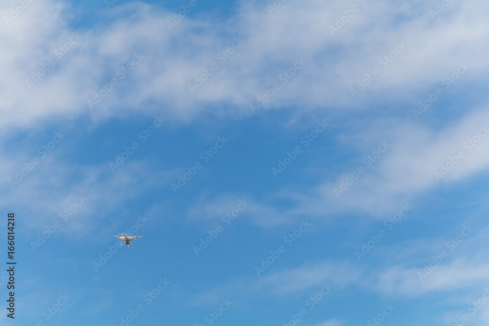 Drone flying in the blue sky