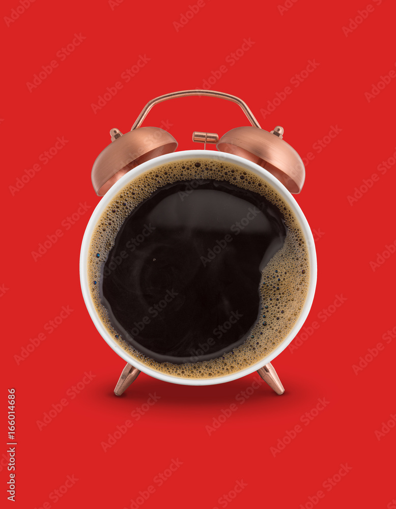 Fotografie Twin bell alarm clock with coffee mug red background
