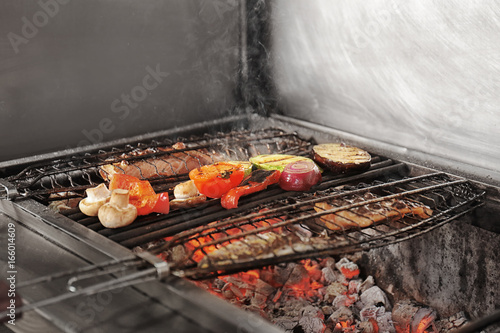 Delicious fish and vegetables on grill