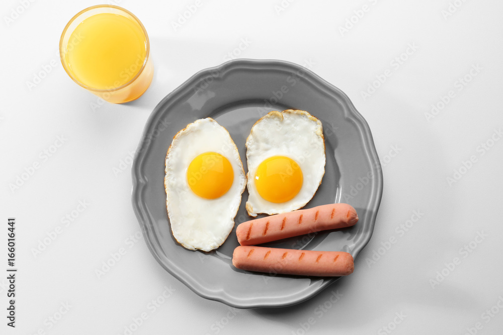 Tasty breakfast with fried eggs on white background Tasty breakfast with fried eggs on white background