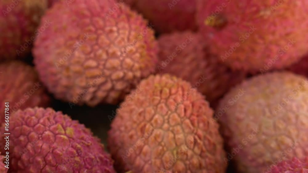 Lychees on a rotating wooden plate (seamless loopable; 4K) Lychees on a rotating wooden plate (seamless loopable; 4K)