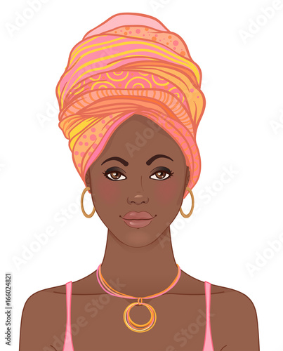 Portrait of beautiful African woman in turban. Tribal style fashion.
