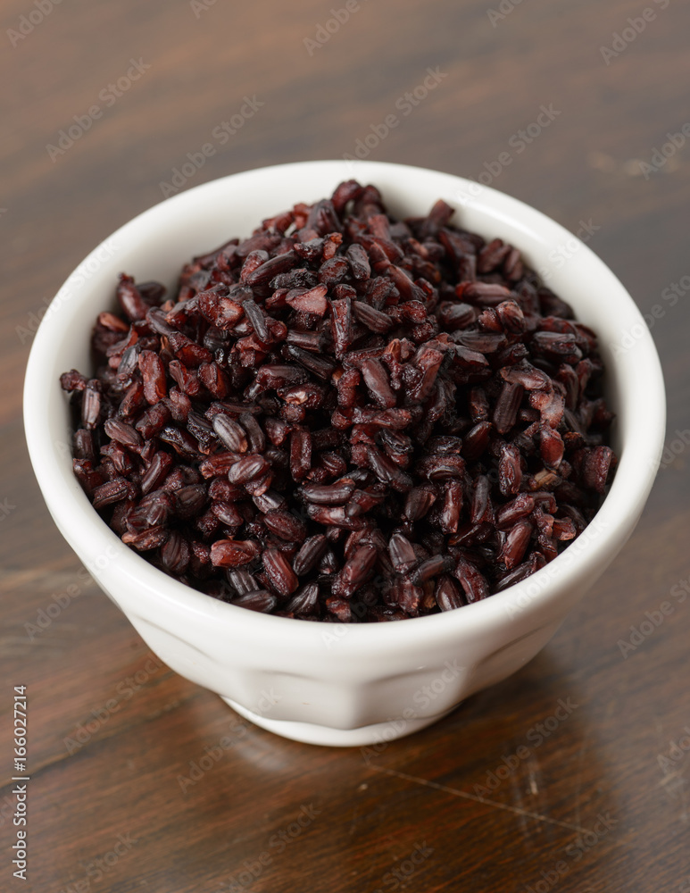 Cooked black rice in bowl Cooked black rice in bowl